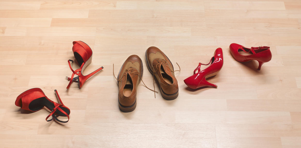 Threesome shoes on bedroom floor