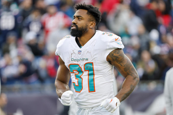 Miami Dolphins running back Raheem Mostert (31) runs off the field during the first half of an NFL football game against the New England Patriots, Sunday, Jan. 1, 2023, in Foxborough, Mass. (AP Photo/Greg M. Cooper)