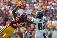 <p>Washington Redskins cornerback Josh Norman (24) attempts to intercept a pass intended for Philadelphia Eagles wide receiver Torrey Smith (82) in the first quarter at FedEx Field. Mandatory Credit: Geoff Burke-USA TODAY Sports </p>