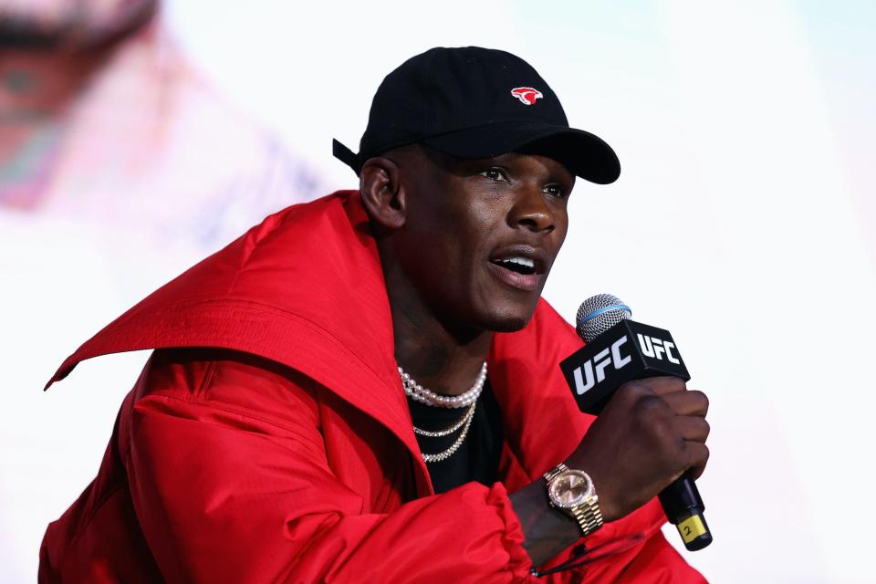 Israel Adesanya speaks to the media.