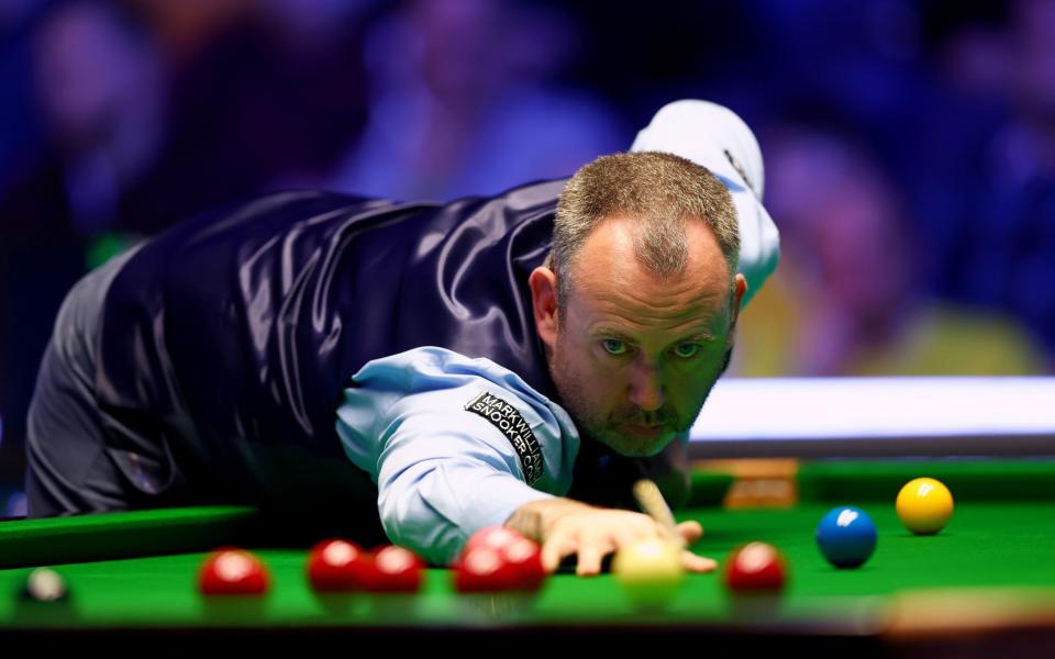 Mark Williams of Wales plays a shot during his round two match against Ding Junhui of China in the 2023 World Grand Prix at Centaur Arena - Getty Images/Dan Istitene