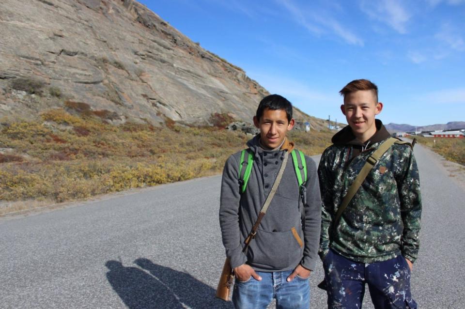 Knud Lyberth, left, with his brother, Enos, on the road that cuts through Kangerlussuaq.&nbsp; (Photo: Alexander C Kaufman / HuffPost)