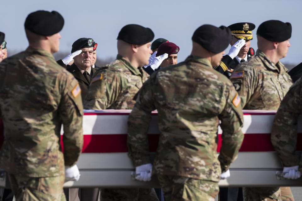 FILE - Joint Chiefs Chairman Gen. Mark Milley, left, U.S. Air Force Chief Master Sgt. Ramon Colon-Lopez, Senior Enlisted Advisor to the Joint Chiefs Chairman, and Vice Chief of the Army Gen. Joseph Martin, and others, salute as an Army carry team moves a transfer case containing the remains of U.S. Army Sgt. 1st Class Michael Goble, Wednesday, Dec. 25, 2019, at Dover Air Force Base, Del. According to the Department of Defense, Goble, of Washington Township, N.J., assigned to the 7th Special Forces Group, died while supporting Operation Freedom's Sentinel. (AP Photo/Alex Brandon, File)