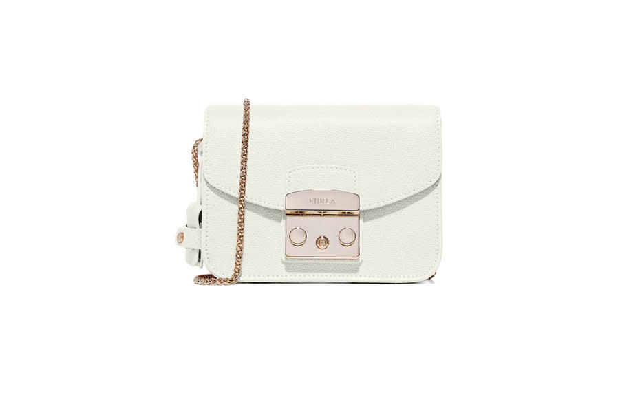 <p>This petite Furla bag is a street style favorite. The delicate chain of the shoulder strap makes it easy to dressup or down.</p><p>To buy: <a rel="nofollow noopener" href="http://www.anrdoezrs.net/links/7876402/type/dlg/sid/TL_crossbodybags/https://www.shopbop.com/metropolis-crossbody-bag-furla/vp/v=1/1500252798.htm" target="_blank" data-ylk="slk:shopbop.com;elm:context_link;itc:0;sec:content-canvas" class="link ">shopbop.com</a>, $298.</p>