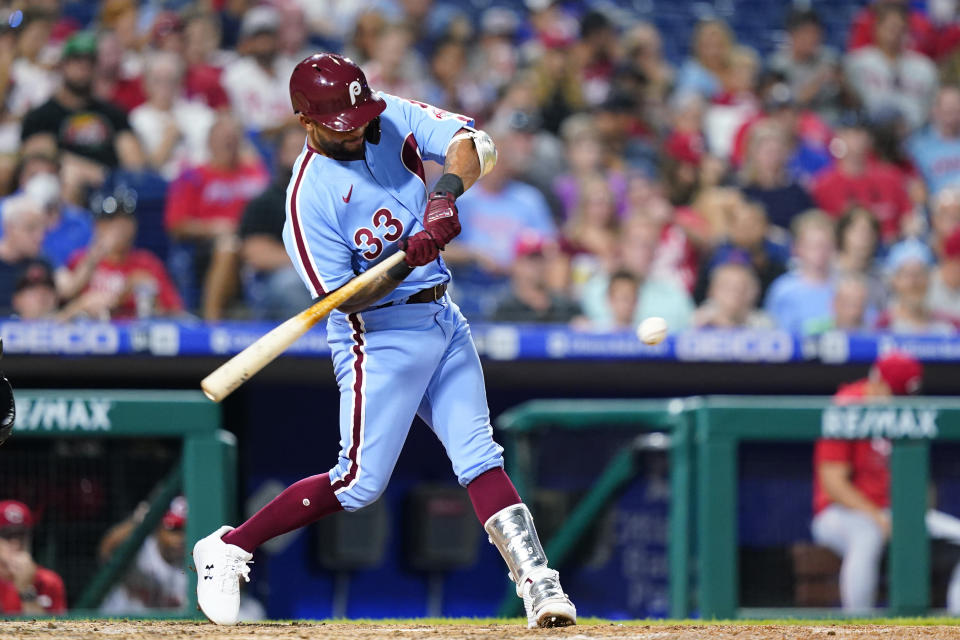 Philadelphia Phillies' Edmundo Sosa hits a two-run single against Cincinnati Reds pitcher Ross Detwiler during the seventh inning of a baseball game, Thursday, Aug. 25, 2022, in Philadelphia. (AP Photo/Matt Slocum)