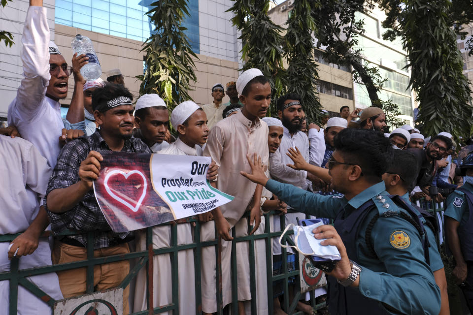 Supporters of several Islamist parties protest after Friday prayers in Dhaka, Bangladesh, Friday, Oct. 30, 2020. Thousands of Muslims and activists marched through streets and rallied across Bangladesh’s capital on Friday against the French president’s support of secular laws that deem caricatures of the Prophet Muhammad as protected under freedom of speech. (AP Photo/Mahmud Hossain Opu)