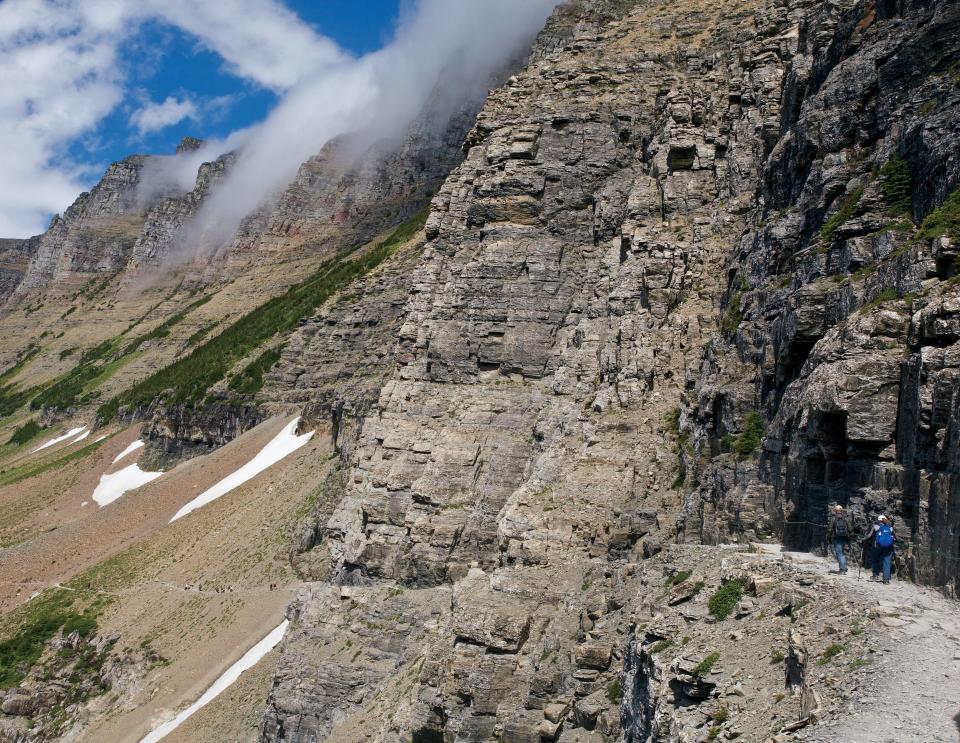 Highline Trail in Montana’s Glacier National Park trail crosses a cliff face with spectacular views into an immense alpine canyon.