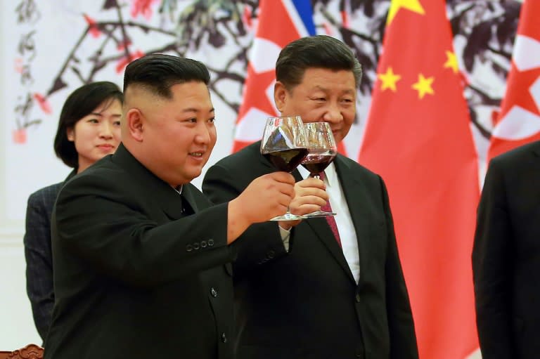 <em>North Korean leader Kim Jong-un and Chinese President Xi Jinping make a toast at the Great Hall of the People in Beijing (AFP)</em>