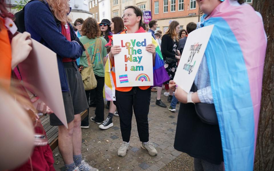 Trans activists gather ahead of a protest of a talk by Prof Kathleen Stock at the Oxford Union - Jonathan Brady/PA