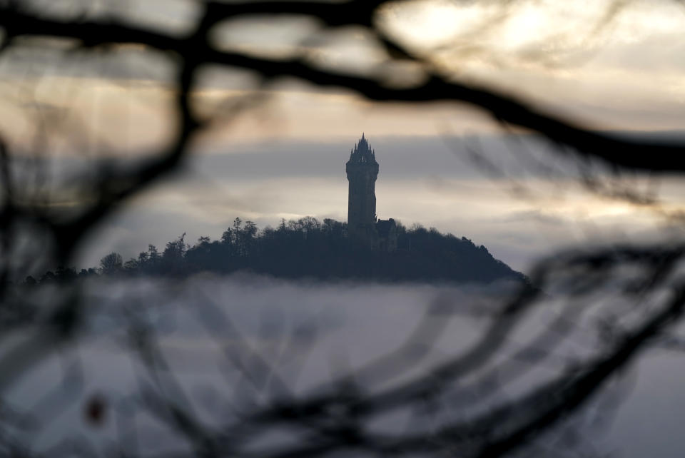 The Wallace Monument sits above the heavy fog, as the fog makes its way through the carse at Stirling this morning. Picture date: Tuesday November 29, 2022.