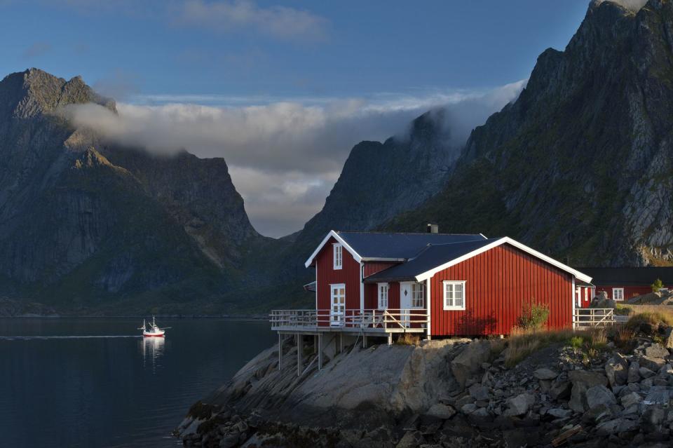 waterfront buildings with peaks in background