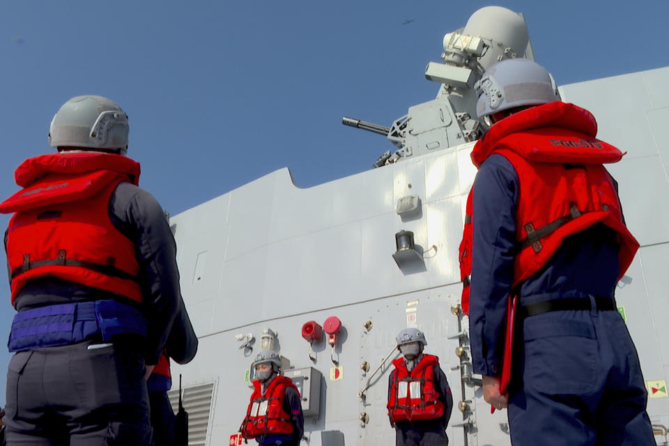 In this image taken from video, Taiwanese sailors on board a corvette stand near the Phalanx close-in weapon system during an anti-aircraft drill in Kaohsiung, Southern Taiwan on Wednesday, Jan. 31, 2024. Taiwan is holding spring military drills following its recent presidential election and amid threats from China, which claims the island as its own territory that it is determined to annex, possibly by force. (AP Photo/Johnson Lai