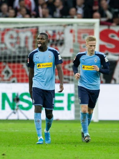 Thuram (L) celebrates scoring the winner in Gladbach's victory against Bayer Leverkusen last Saturday