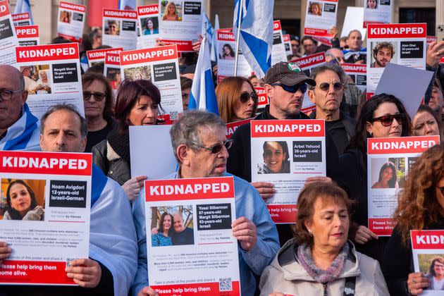 Protesters hold placards with the names of the hostages on them during the demonstration in Trafalgar Square in London.