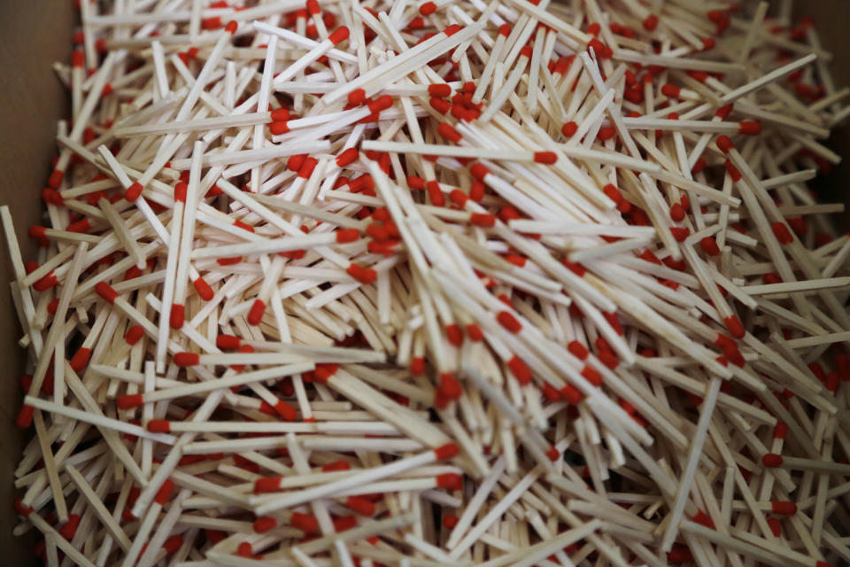 Matches come one after the other, produced on an assembly line at a Nittosha factory in Himeji, Japan, Wednesday, June 29, 2022. Nittosha, a small Japanese manufacturer, is stopping the production of matchbooks. The company, which employs 130 people, is a testament to the hard work and dedication at small and medium-size companies that are the backbones of large economies, including the U.S. and Japan. (AP Photo/Yuri Kageyama)