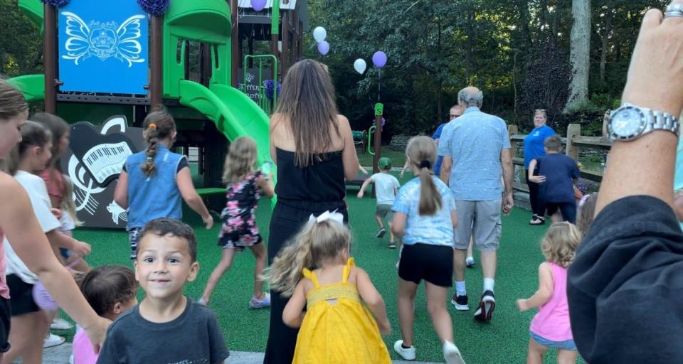 Kids race onto a new Where Angels Play playground in Ocean Township following the dedication on Sept 12, 2023.