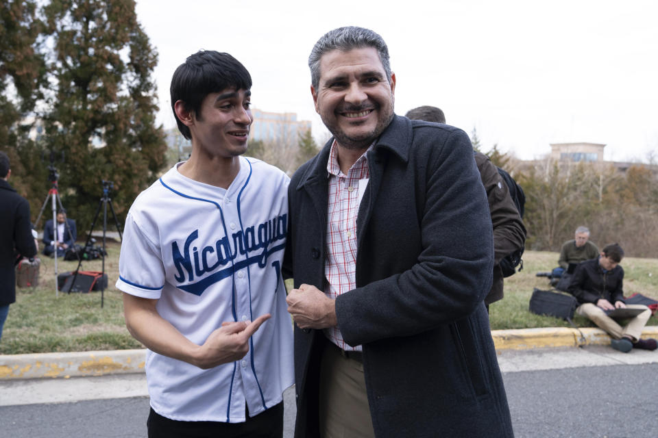 Nicaraguan Juan Sebastián Chamorro, right, is greeted by Nahiroby Olivas after arriving from Nicaragua at Washington Dulles International Airport, in Chantilly, Va., on Thursday, Feb. 9, 2023. Some 222 inmates considered by many to be political prisoners of the government of Nicaraguan President Daniel Ortega arrived in Washington after an apparently negotiated release. (AP Photo/Jose Luis Magana)