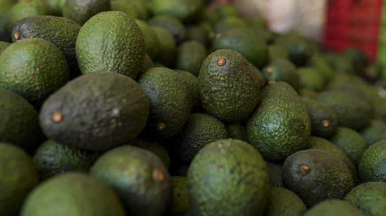 A pile of avocados