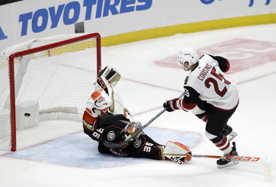 Arizona Coyotes' Nick Cousins, right, scores past Anaheim Ducks goaltender John Gibson during the shootout of an NHL hockey game Wednesday, Oct. 10, 2018, in Anaheim, Calif. Arizona won 3-2. (AP Photo/Marcio Jose Sanchez)