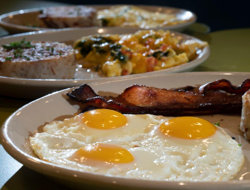 Egg dishes from Snooze, A.M. Eatery Wednesday, Jan. 11, 2023, in Nashville, Tenn. Restaurants and consumers are dealing with increasing egg prices.  