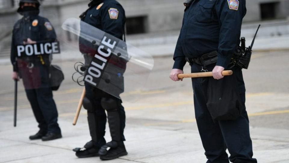 Police in riot gear monitor activity outside the Pennsylvania Capitol Building on January 17, 2021 in Harrisburg, Pennsylvania. (Photo by Mark Makela/Getty Images)