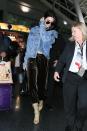 <p>Jenner is a pro when it comes to comfy, yet stylish airport attire. Velvet joggers and a denim jacket is definitely a killer combo. [Photo: Getty] </p>