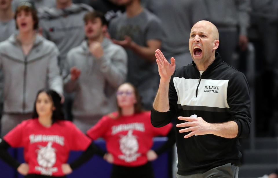 Hiland basketball coach Mark Schlabach works the sideline during the first half of a Division IV state semifinal basketball game at UD Arena, Friday, March 17, 2023, in Dayton, Ohio.