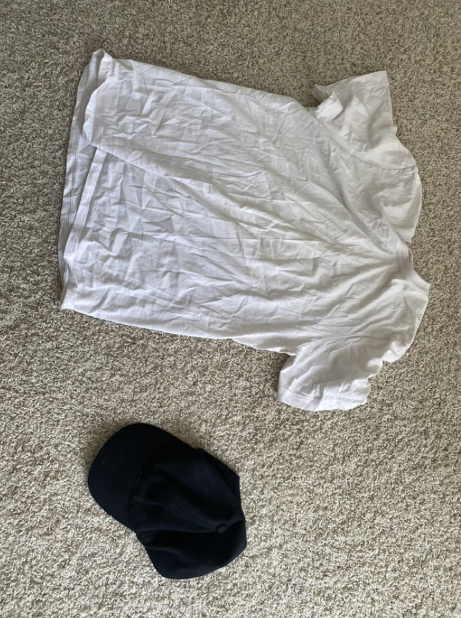 a shirt and hat on the floor