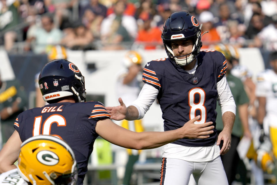 Chicago Bears place kicker Cairo Santos (8) celebrates his field goal with holder Trenton Gill during the first half of an NFL football game against the Green Bay Packers Sunday, Sept. 10, 2023, in Chicago. (AP Photo/Nam Y. Huh)