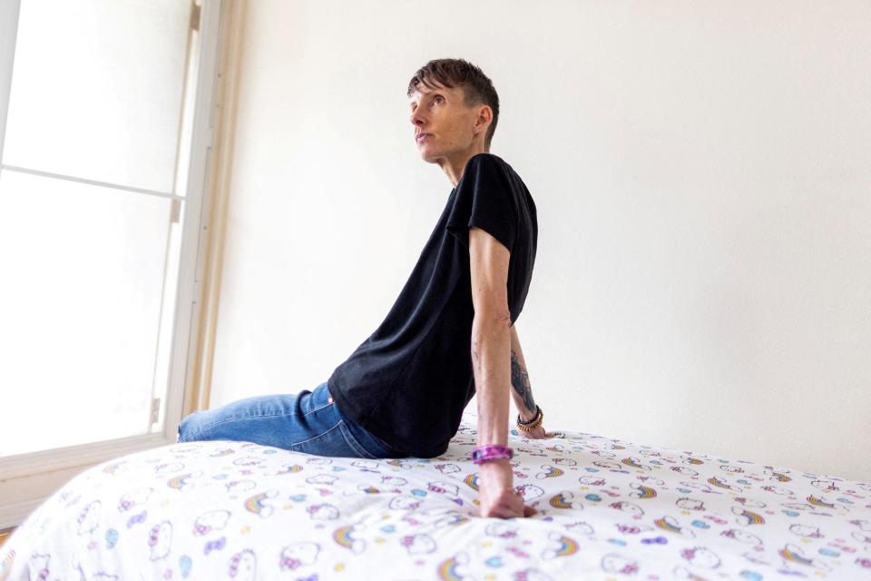 Lisa Pauli, 47, who says she wants to apply for medical assistance in dying (MAiD) when she is eligible because of her severe anorexia, sits on a bed, in Toronto, Ontario, Canada June 9, 2023.