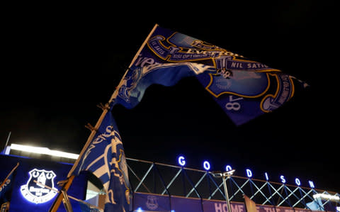 An Everton flag flies outside Goodison Park - Credit: Carl Recine/Reuters