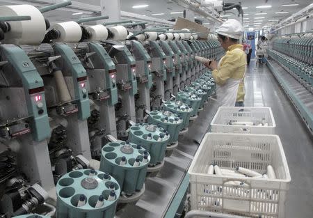 A worker is seen in Youngor's cotton spinning factory, in Aksu, Xinjiang Uighur Autonomous Region, December 1, 2015. REUTERS/Dominique Patton