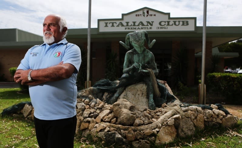 Fishing veteran Mimmo Oteri in front of the club's statue of Pan. Picture: Michael Wilson/The West Australian