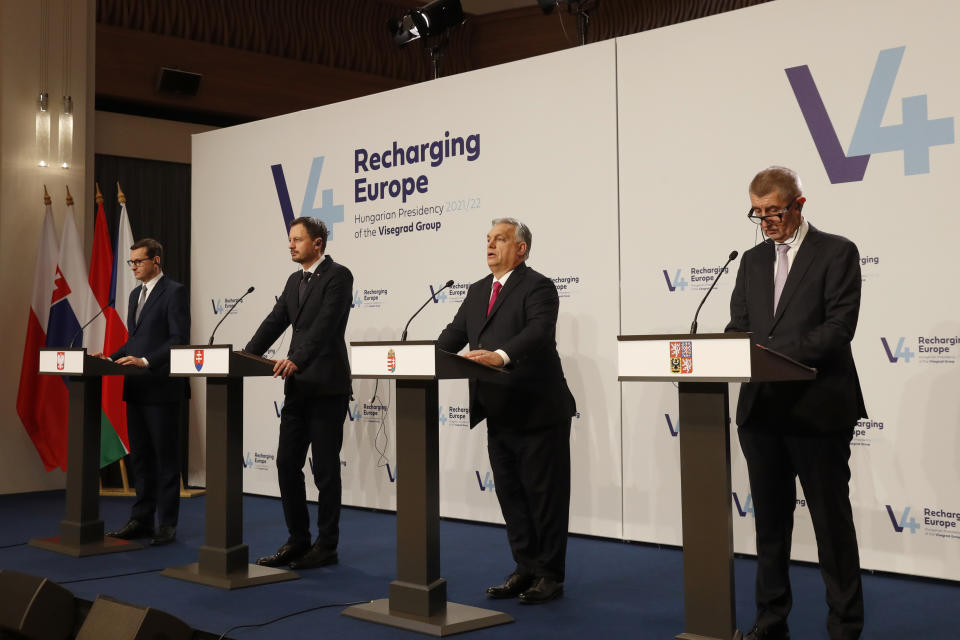 From left: Prime Ministers Mateusz Morawiecki of Poland, Viktor Orban of Hungary, Eduard Heger of Slovakia and Andrej Babis of the Czech Republic address the media at a news briefing in Budapest, Hungary, Tuesday, Nov. 23, 2021. The leaders of the Visegrad Four group of Central European countries met in Hungary's capital of Budapest Tuesday to discuss the ongoing migration crisis along Poland's border with Belarus. (AP Photo/Laszlo Balogh)