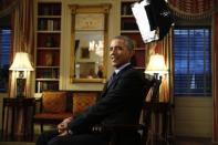 U.S. President Barack Obama takes his seat for an exclusive interview with Reuters in the Library of the White House in Washington March 2, 2015. REUTERS/Kevin Lamarque