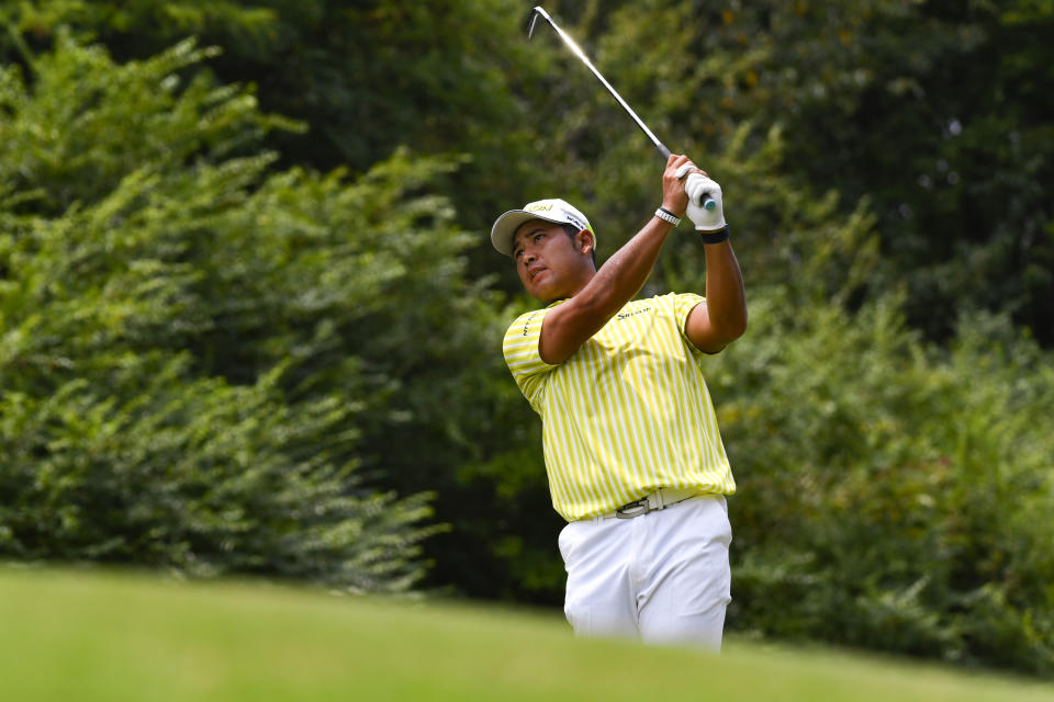 Hideki Matsuyama, of Japan, hits to the fourth hole during the final round in the World Golf Championship-FedEx St. Jude Invitational tournament, Sunday, Aug. 8, 2021, in Memphis, Tenn. (AP Photo/John Amis)