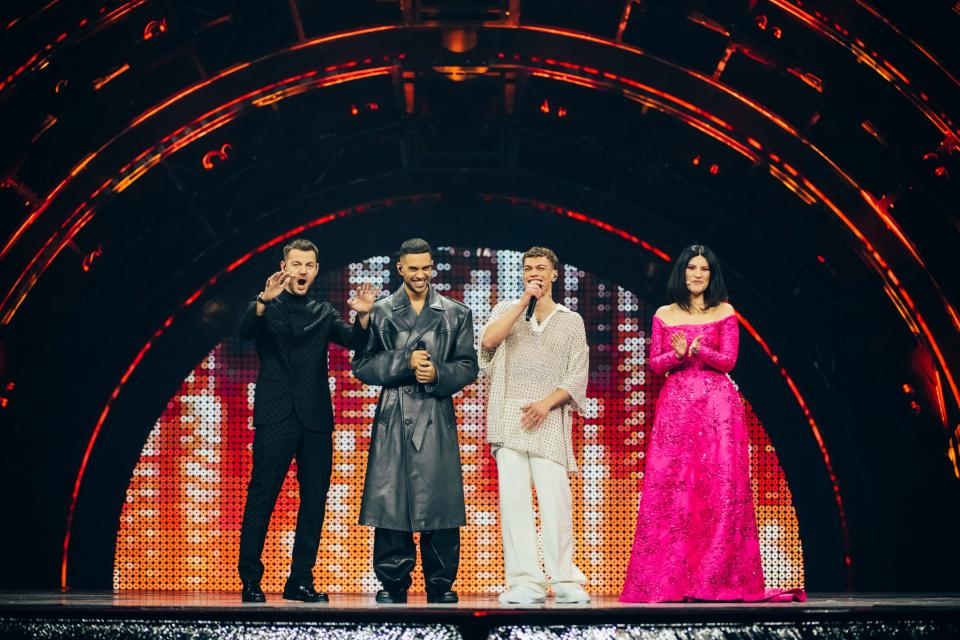 From left: Host Alessandro Cattelan, Mahmood, Blanco and host Laura Pausini, wearing a Valentino Pink PP look on stage during the first semifinal. - Credit: Sarah Louise Bennett/Courtesy of EBU