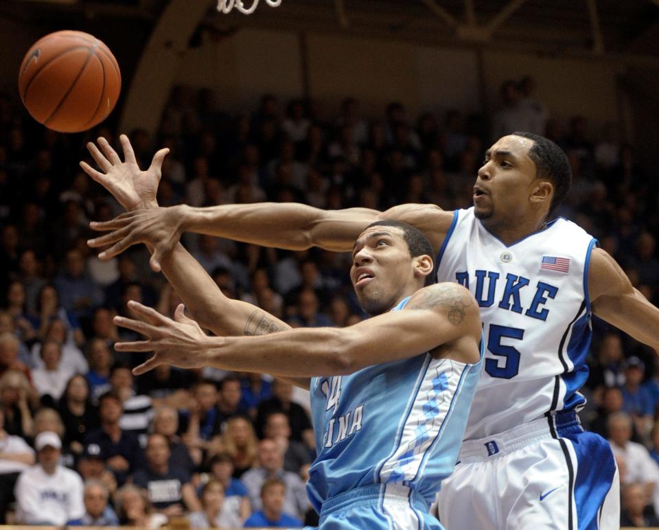 North Carolina's Danny Green, left, shoots as Duke's Gerald Henderson defends during the first half of an NCAA college basketball game in Durham, N.C., Wednesday, Feb. 11, 2009. 