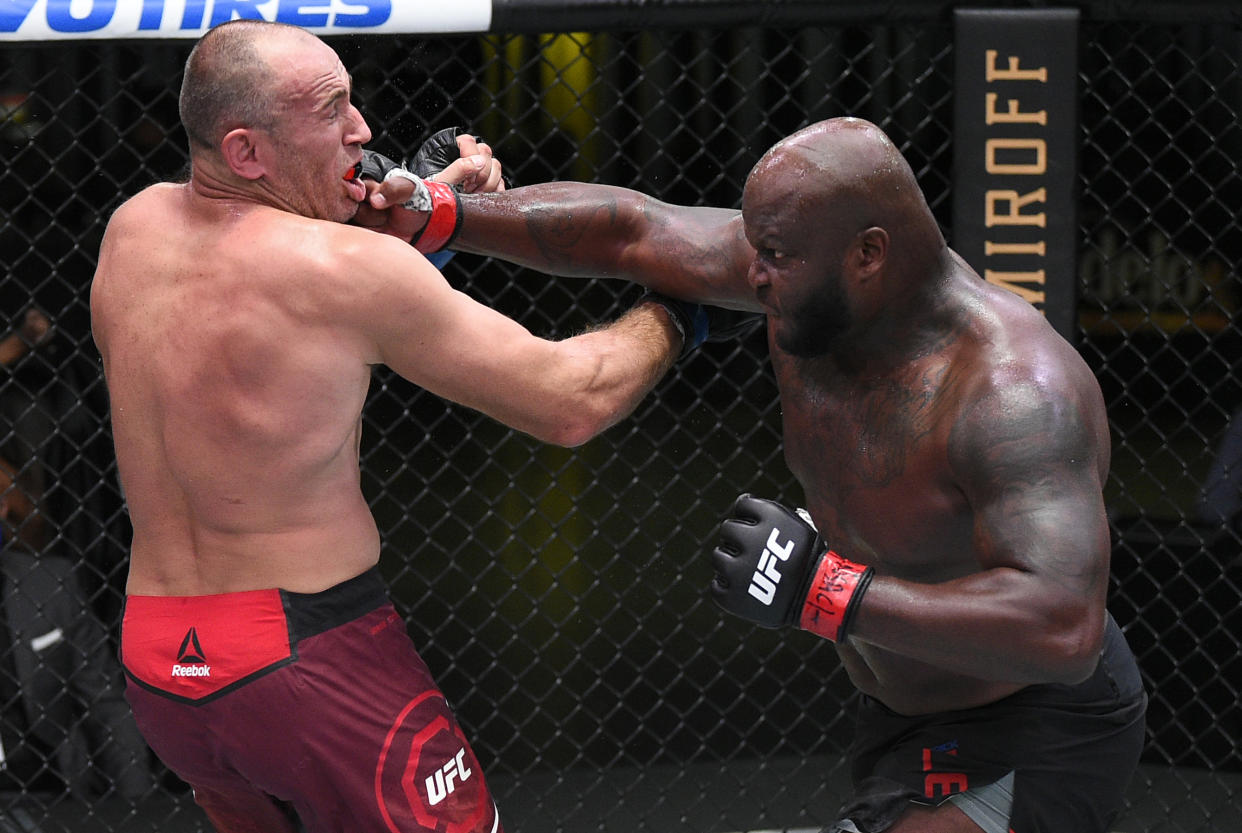 LAS VEGAS, NEVADA - AUGUST 08: (R-L) Derrick Lewis punches Aleksei Oleinik of Russia in their heavyweight fight during the UFC Fight Night event at UFC APEX on August 08, 2020 in Las Vegas, Nevada. (Photo by Chris Unger/Zuffa LLC)