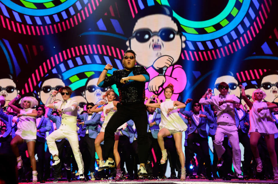 "Gangnam Style," a music video featuring the infectious, meme-ready dance moves of a little-known South Korean rapper named Psy, became the most-watched video in YouTube history in 2012, racking up more than 815 million views and knocking Justin Bieber off the most-viewed throne. (Kevin Mazur/WireImage)