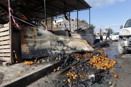 A damaged fruit shop is seen at the site of twin car bombs in Benghazi, Libya, January 24, 2018. REUTERS/Esam Omran Al-Fetori
