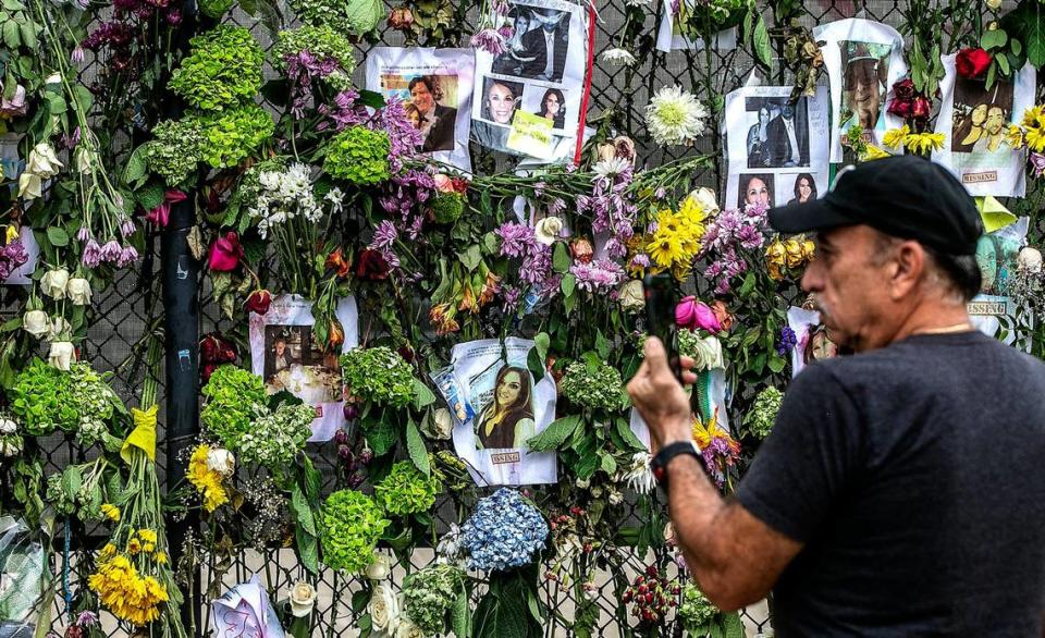 Mario Gonzalez visits the memorial wall of photos of the missing, messages of love, support and prayers at Harding Avenue and 86th Street on the sixth day after the Champlain Towers South collapse in Surfside, on Tuesday, June 29, 2021.