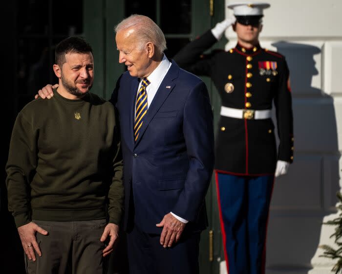 WASHINGTON, DC - DECEMBER 21: President Joe Biden and First Lady Dr. Jill Biden greet President Volodymyr Zelenskyy of Ukraine, as he arrives at the White House on Wednesday, Dec. 21, 2022 in Washington, DC. (Kent Nishimura / Los Angeles Times)