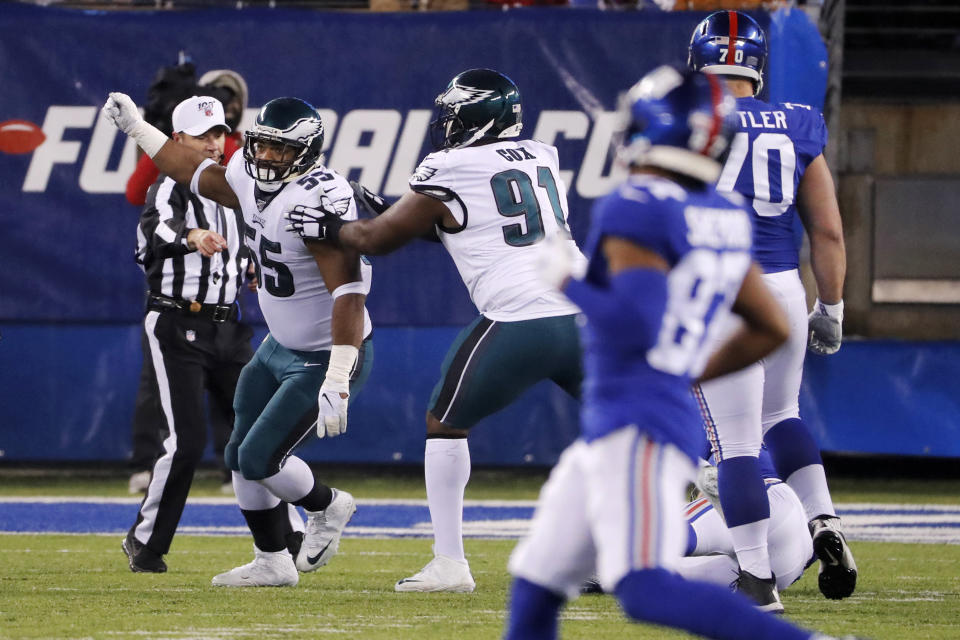 Philadelphia Eagles defensive end Brandon Graham (55) celebrates with Eagles defensive tackle Fletcher Cox (91) after sacking New York Giants quarterback Daniel Jones (8) in the first half of an NFL football game, Sunday, Dec. 29, 2019, in East Rutherford, N.J. (AP Photo/Seth Wenig)