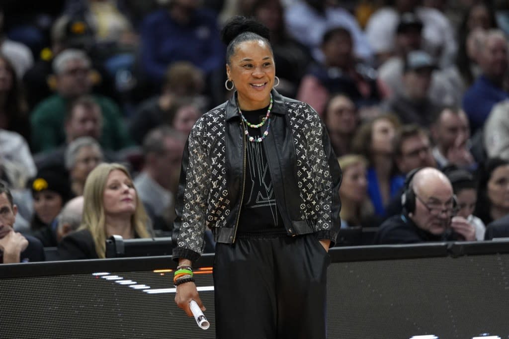 South Carolina head coach Dawn Staley watches from the bench during the second half of a Final Four college basketball game against North Carolina State in the women’s NCAA Tournament, Friday, April 5, 2024, in Cleveland. (AP Photo/Carolyn Kaster)