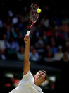 Bernard Tomic of Australia serves during the Gentlemen's Singles third round match against Richard Gasquet of France on day six of the Wimbledon Lawn Tennis Championships at the All England Lawn Tennis and Croquet Club on June 29, 2013 in London, England.