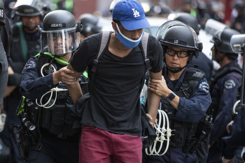 Los Angeles, CA, Tuesday, June 2, 2020 - Dozens of protesters are arrested for curfew violations on Broadway, near 5th after a long day of protesting the homicide of George Floyd. (Robert Gauthier / Los Angeles Times)