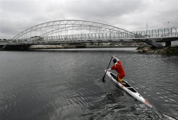 Spain's David Cal paddles his canoe single (C1) during a training session on the River Lerez in the city of Pontevedra May 17, 2012. Cal is months away from a shot at winning a fifth Olympic medal, which would make him Spain's most decorated Olympian. The man who had the honor of carrying the Spanish flag at the opening ceremony in the Beijing Olympics competes in the C1 class canoe, where the competitor kneels in his craft and uses a single paddle down one side.