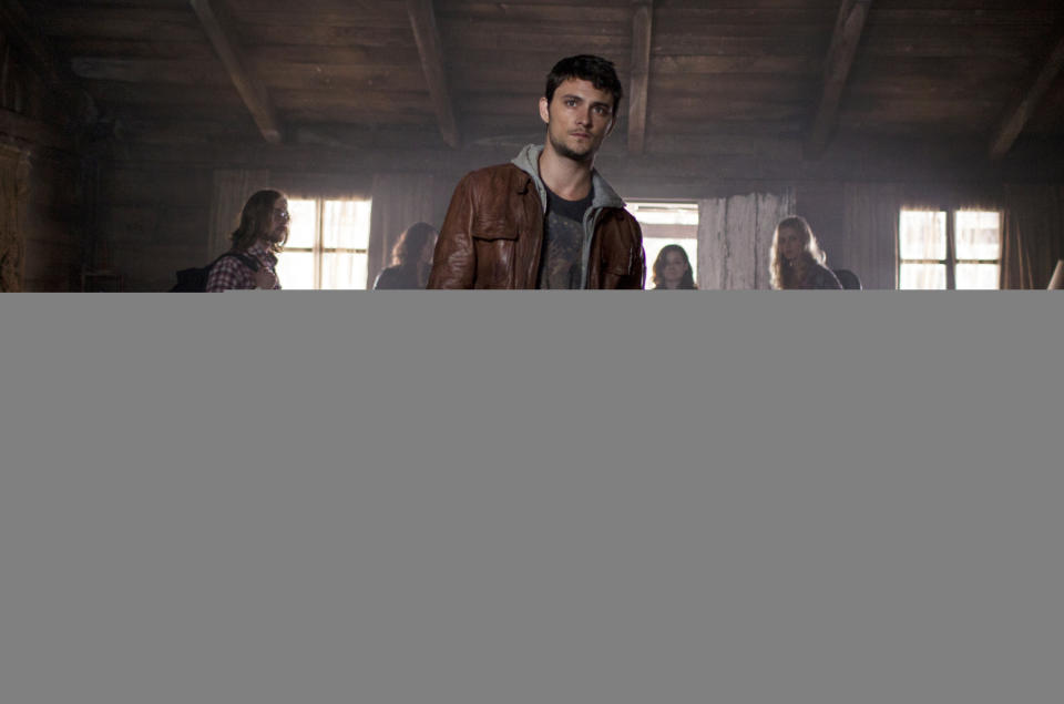 This film image released by Sony-TriStar Pictures shows Shiloh Fernandez, center, in a scene from "Evil Dead." (AP Photo/ Sony-TriStar Pictures, Kirsty Griffin)