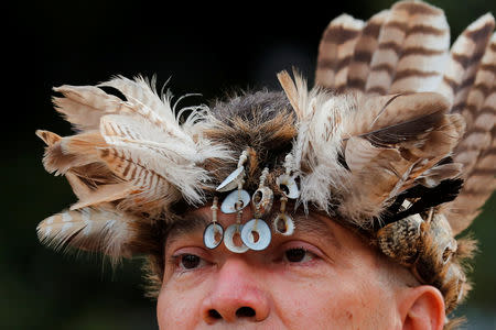 Kevin Nunez of the Gabrielino-Tongva tribe participates in a sunrise ceremony after Los Angeles City Council voted to establish the second Monday in October as "Indigenous People's Day", replacing Columbus Day, in Los Angeles, California, U.S., October 8, 2018. REUTERS/Mike Blake